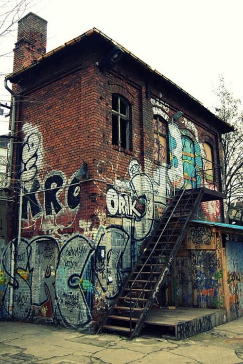Graffiti-covered brick building