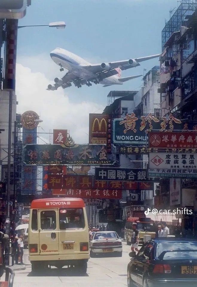 Airplane Over Busy Street
