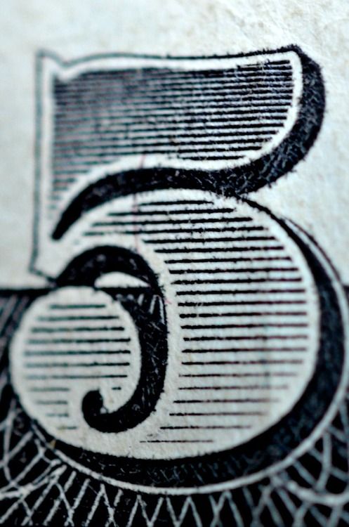 Close-Up of Number Six on Currency