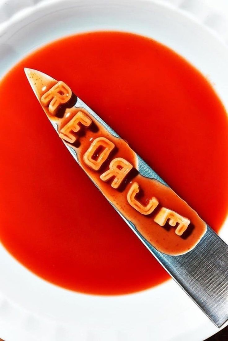Cum-covered knife in red sauce