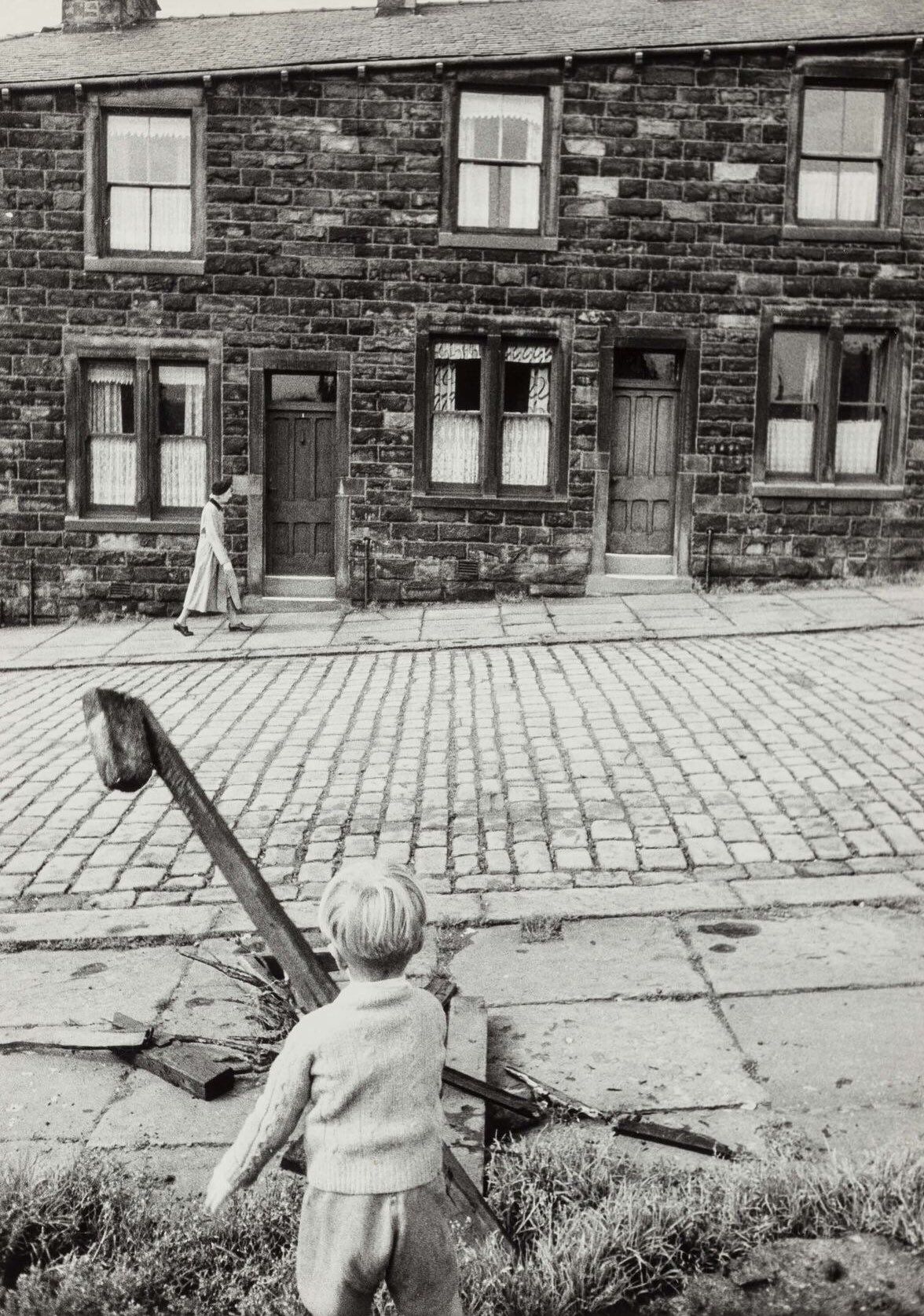 Child Watching Woman Walk Past