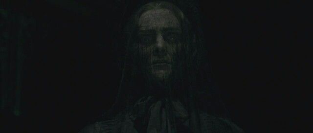 Dark Haired Man in Shadows