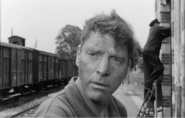 Man Amidst Train Cars