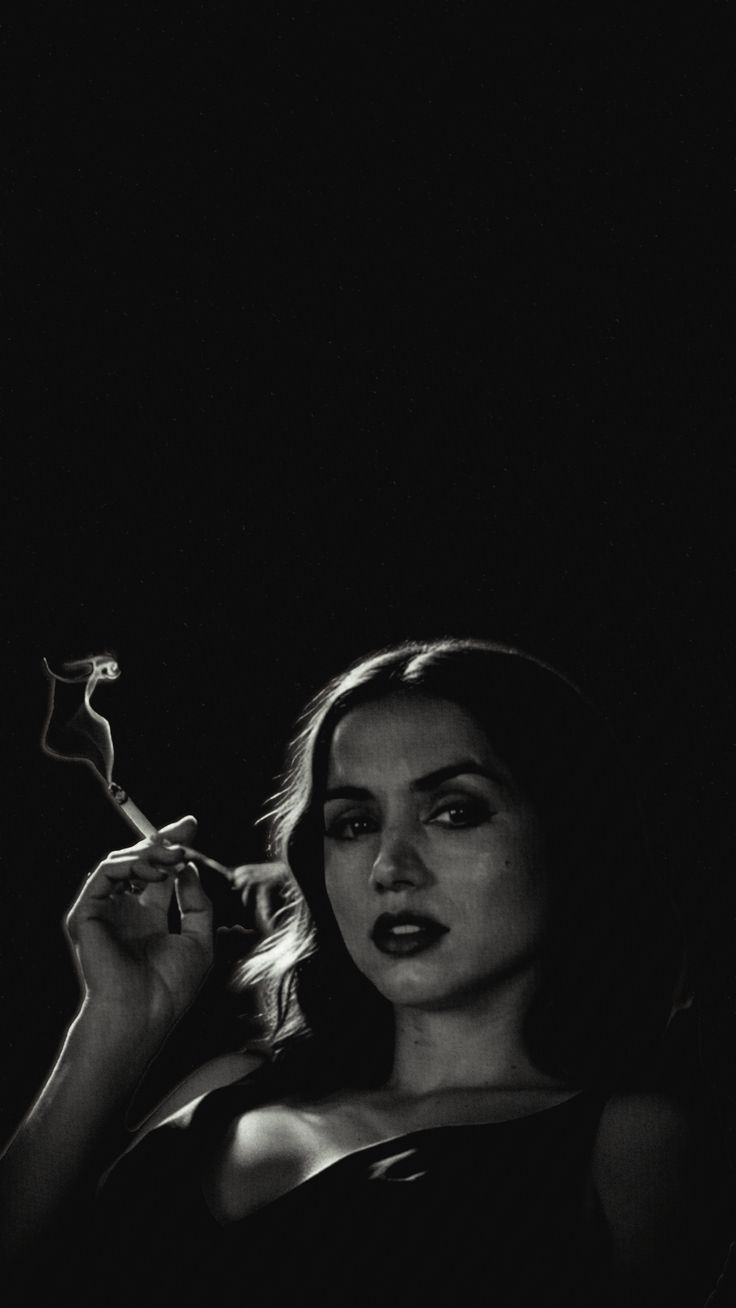 Woman Smoking in Dark