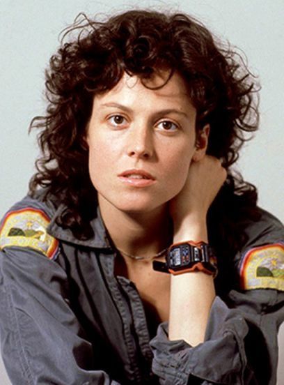 Curly-haired Woman in Flight Suit