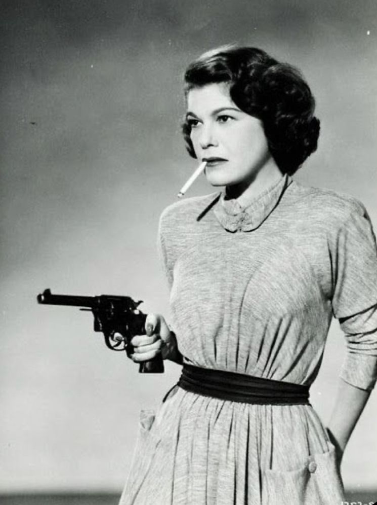 Vintage woman with gun and cigarette