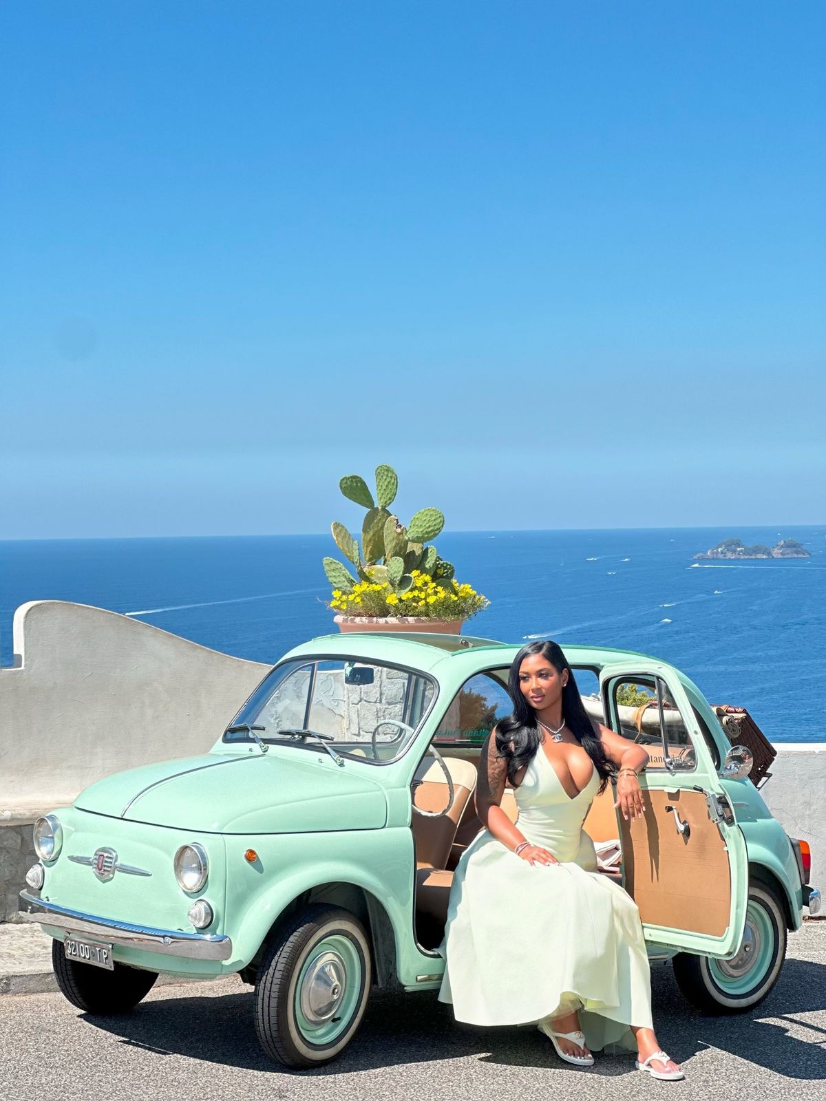 Vintage Fiat with Woman in White Dress