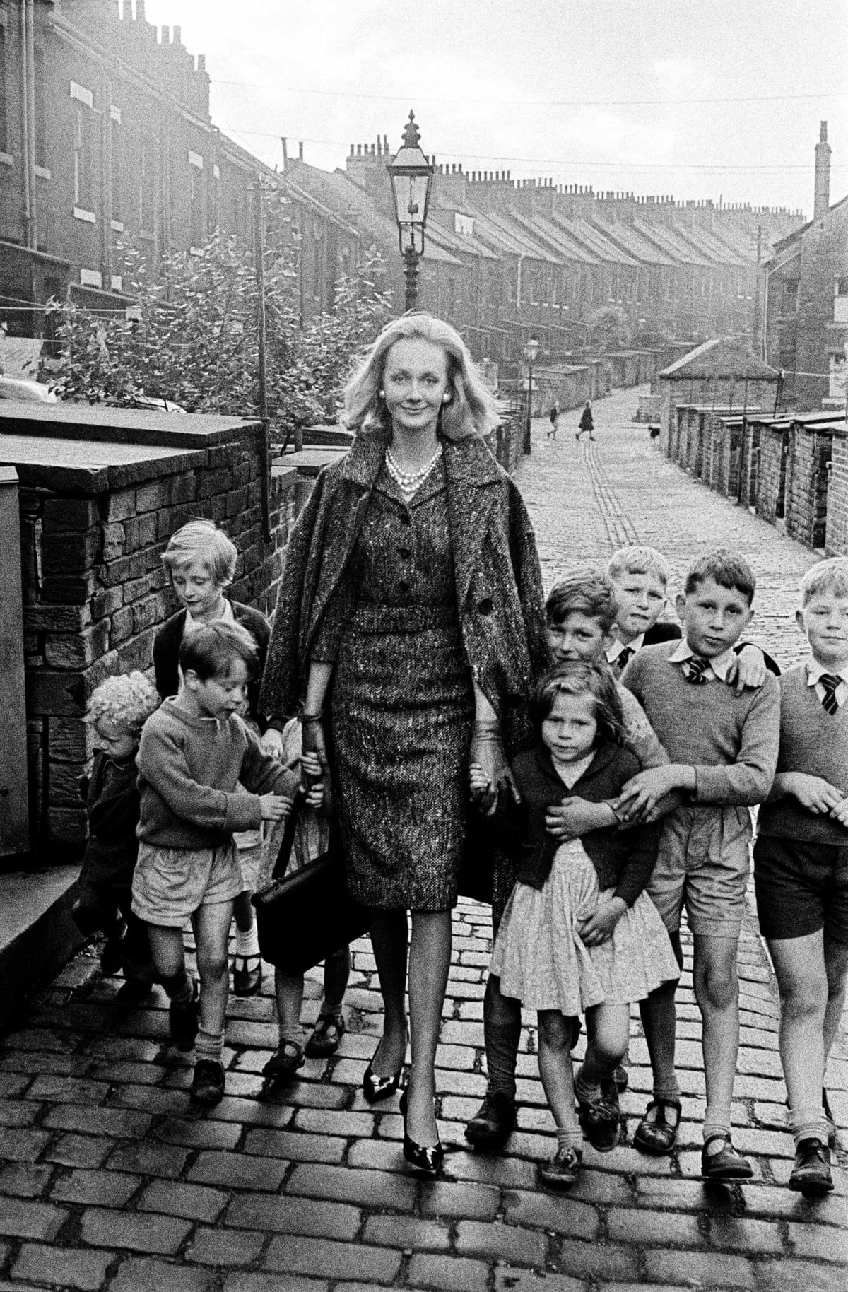 Woman Surrounded by Children