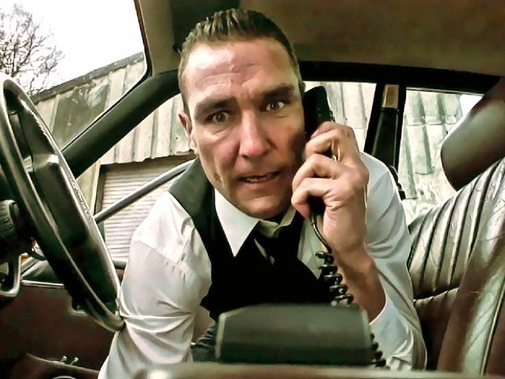 Man in car talking on phone