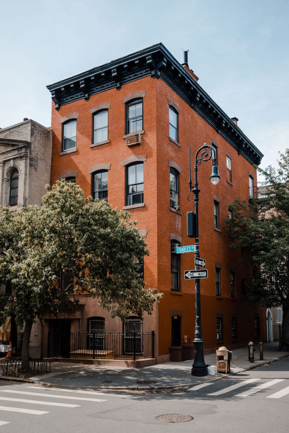 Red brick building with street signs
