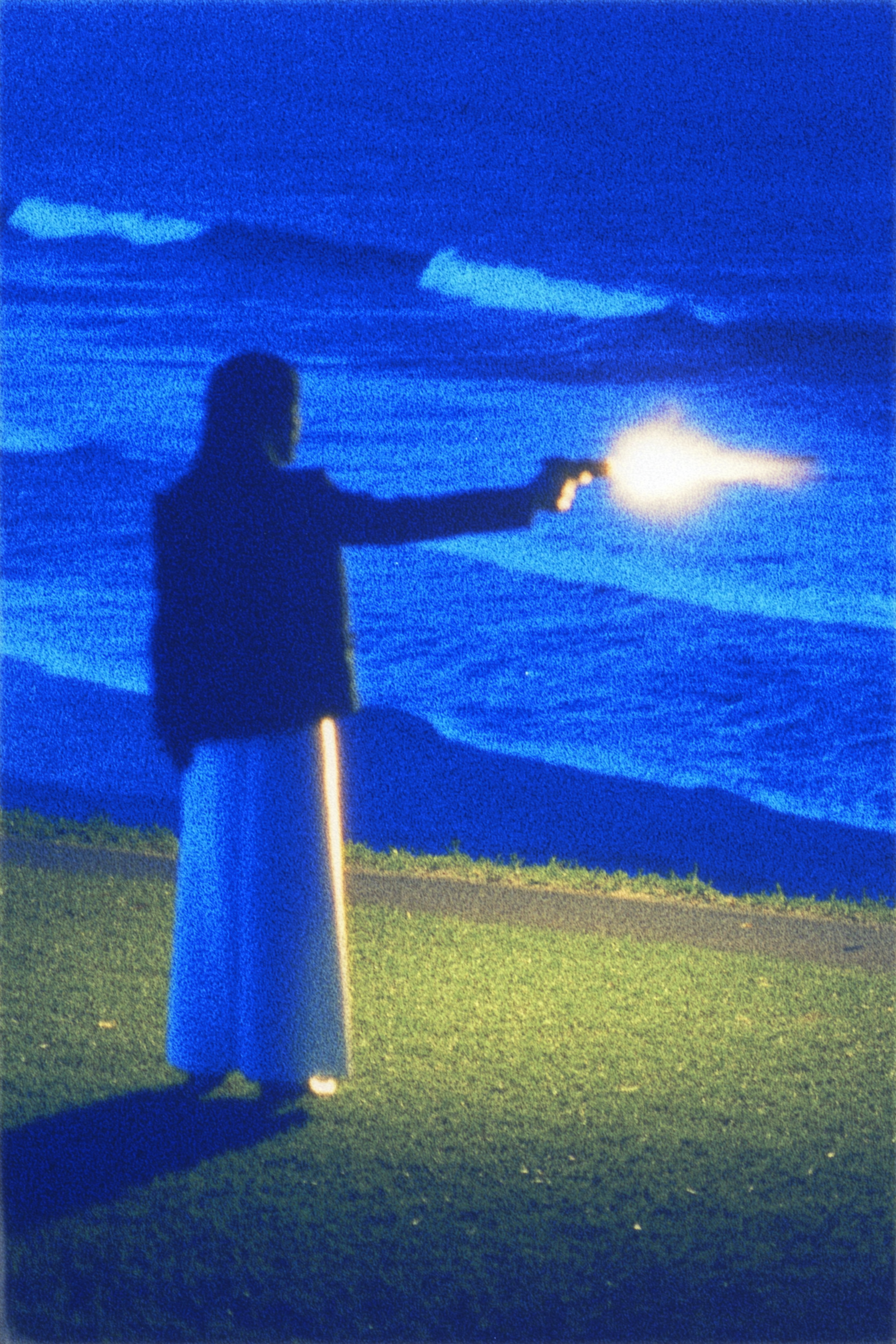 Silhouette of Person Pointing at Ocean