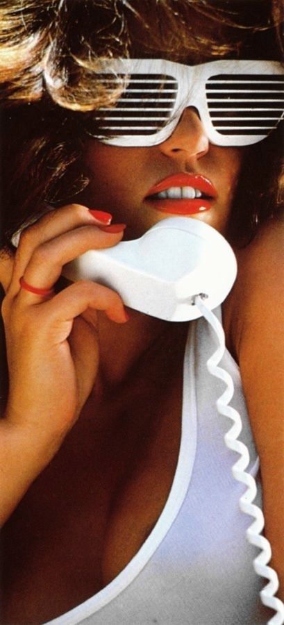 Woman with red nails holding a white object