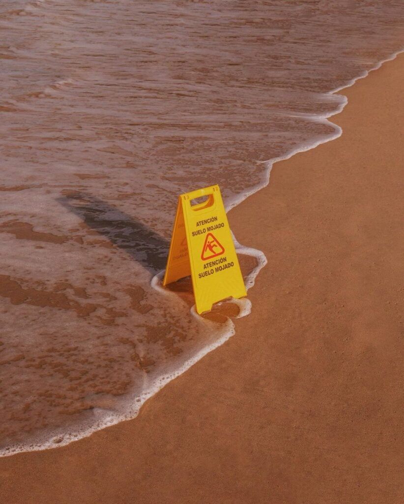 Slippery Beach Warning Sign