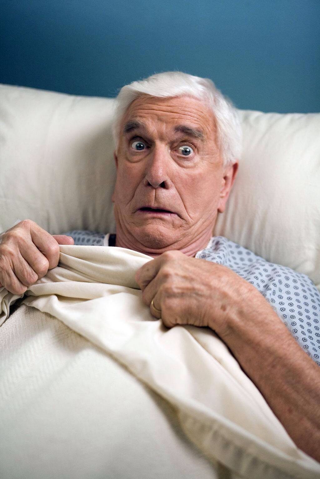 elderly man in hospital bed