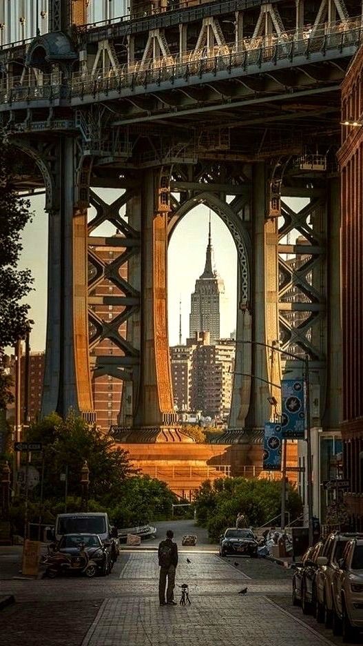 Empire State Building framed by bridge