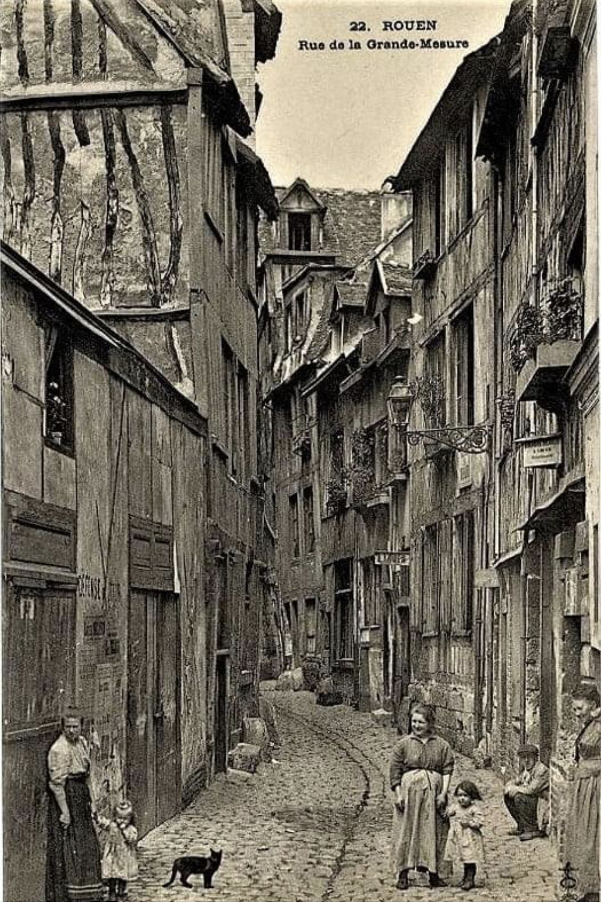 Narrow cobblestone alley with old timbered houses