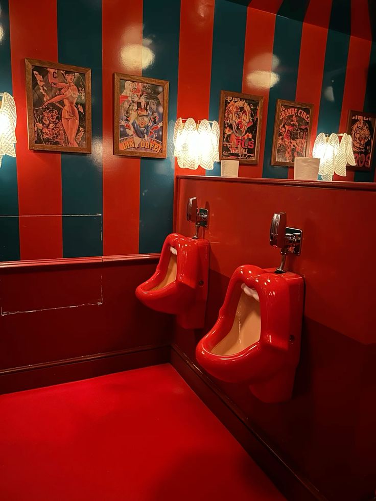 Red Urinals with Comic Posters