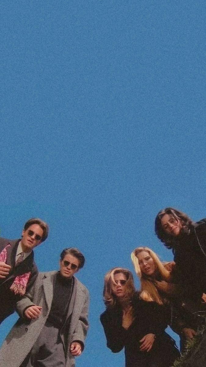 Group of people against blue sky