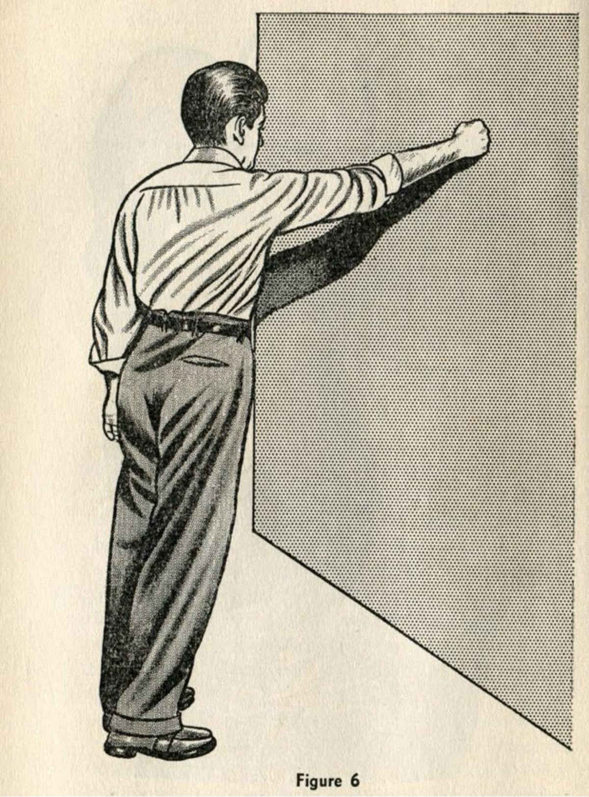 Man in Formalwear Punching Wall