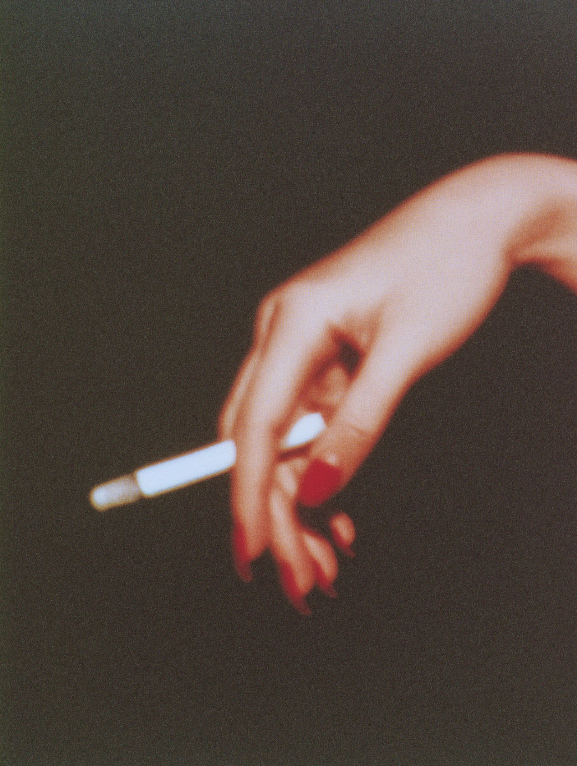 Hand holding cigarette