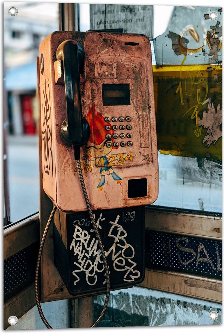 Graffiti-covered payphone