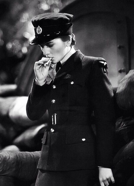 Woman in uniform smoking