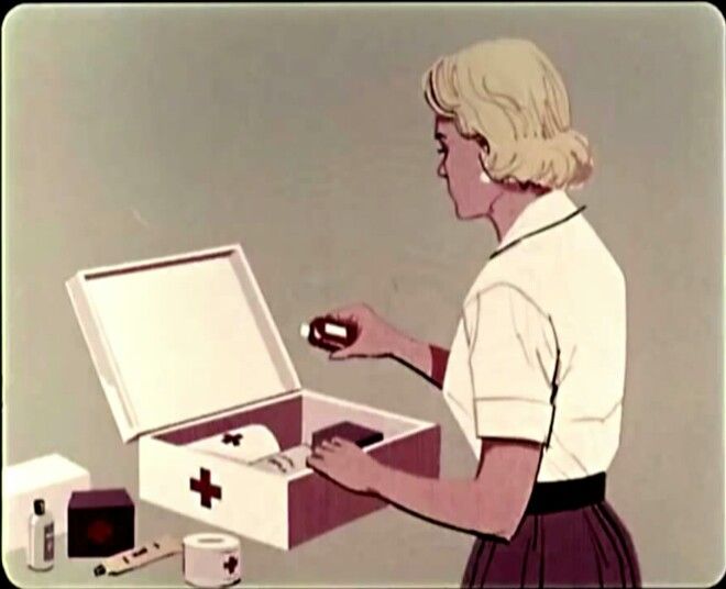 Woman Organizing First Aid Kit