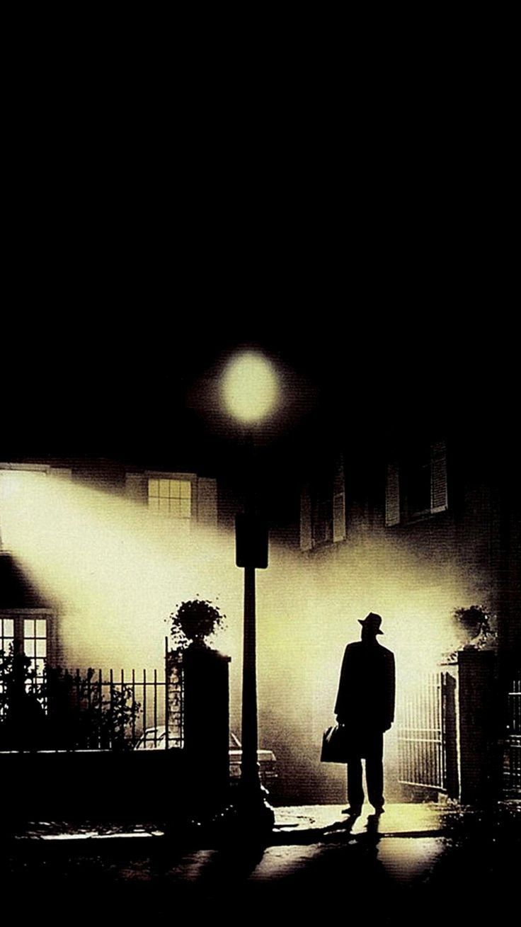 Silhouette under streetlamp