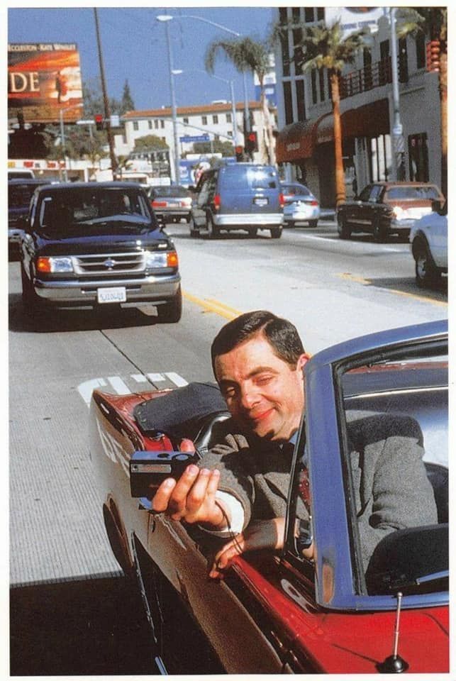 Man in Car Holding Microphone