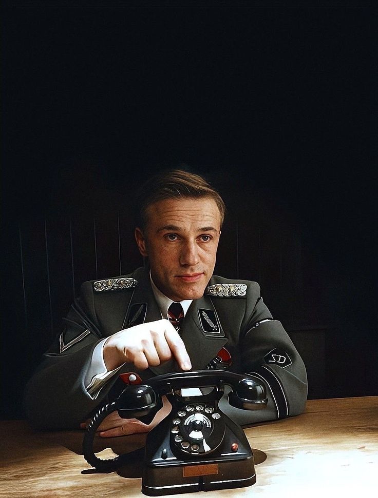 Man in Military Uniform Holding Phone