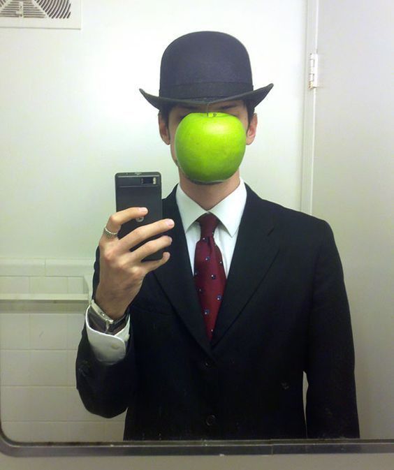 Man in Suit with Apple Mask