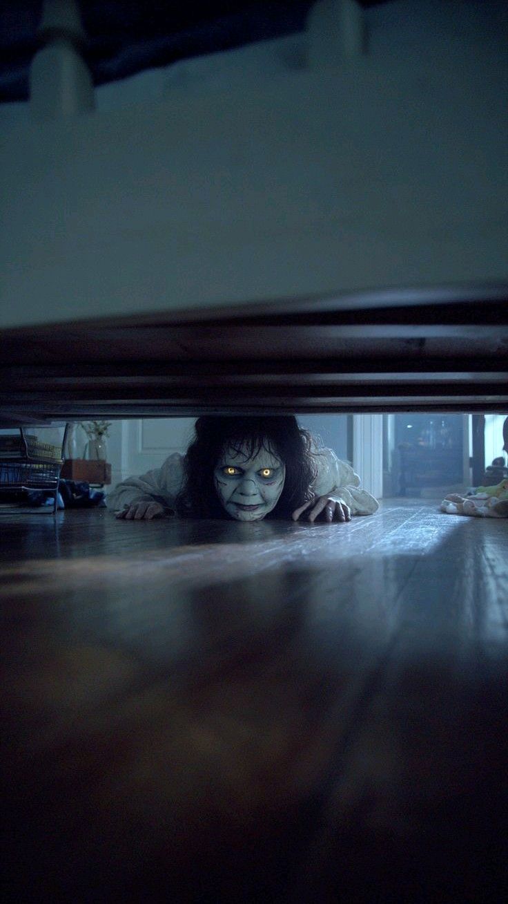 Creepy figure under bed