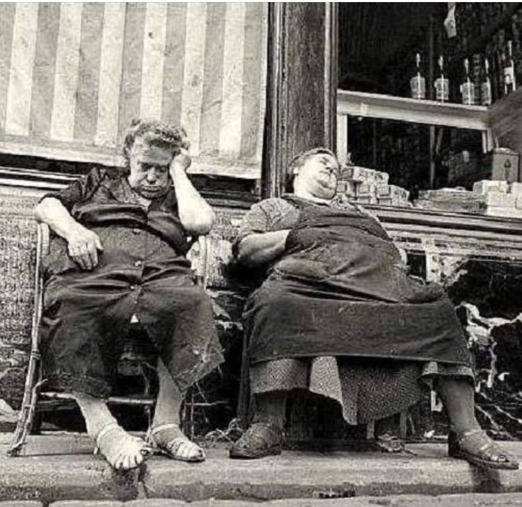 Two Women Sleeping on Steps