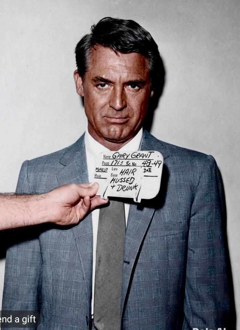 Cary Grant Holding Clapperboard