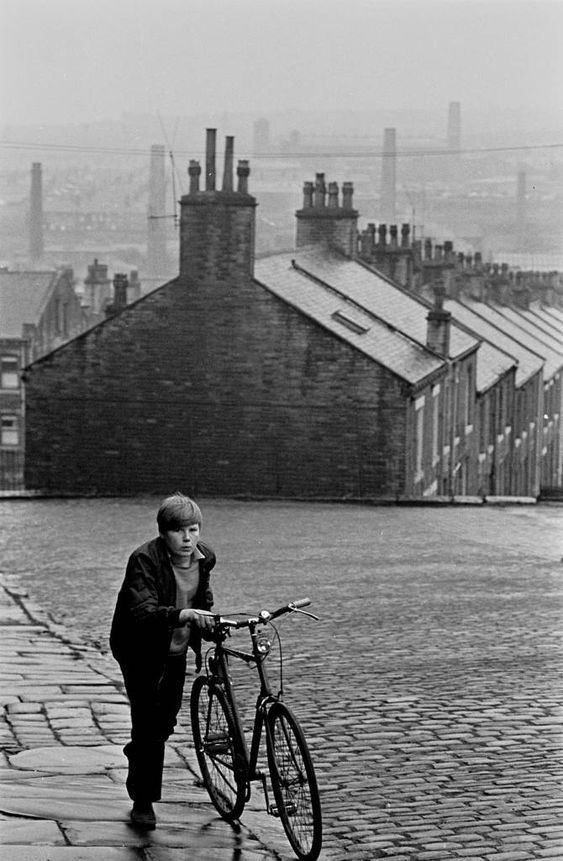 Boy with Bicycle in Urban Setting