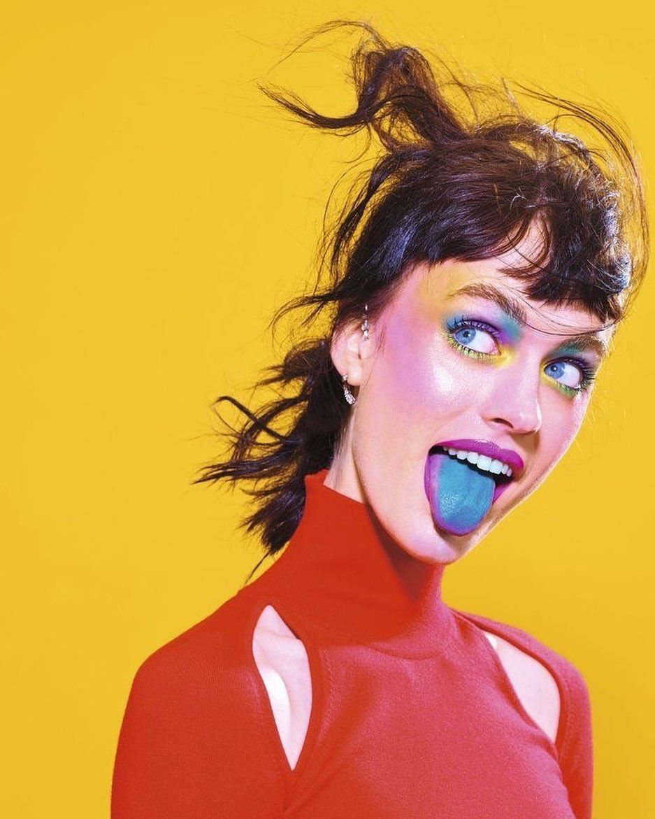 Vividly Painted Woman Tongue-Out