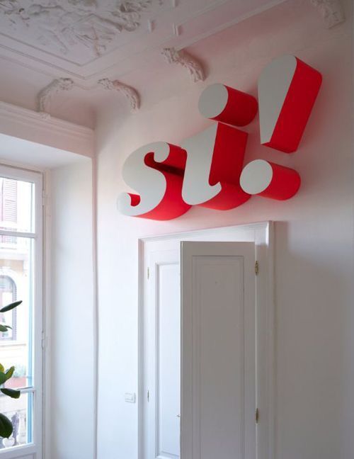 Red 'si!' Sign Over Doorway