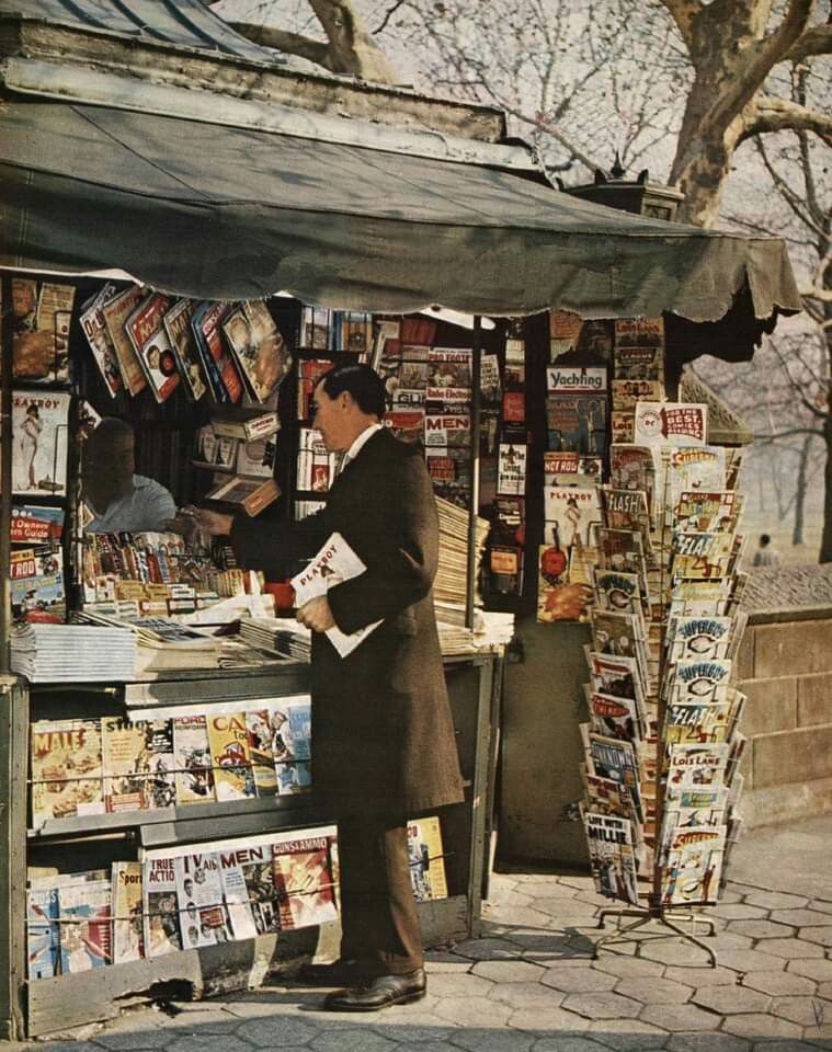 Man browsing magazines at a newsstand