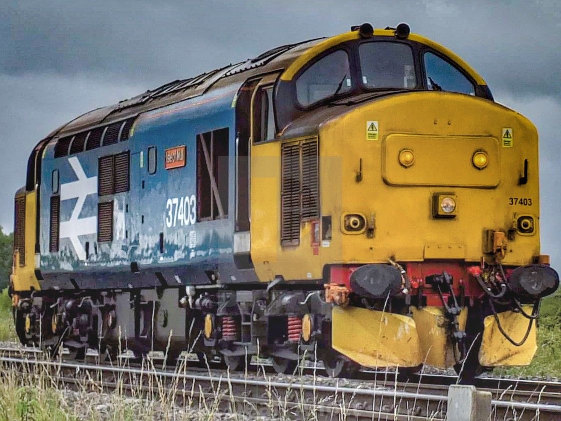 Yellow Locomotive on Tracks
