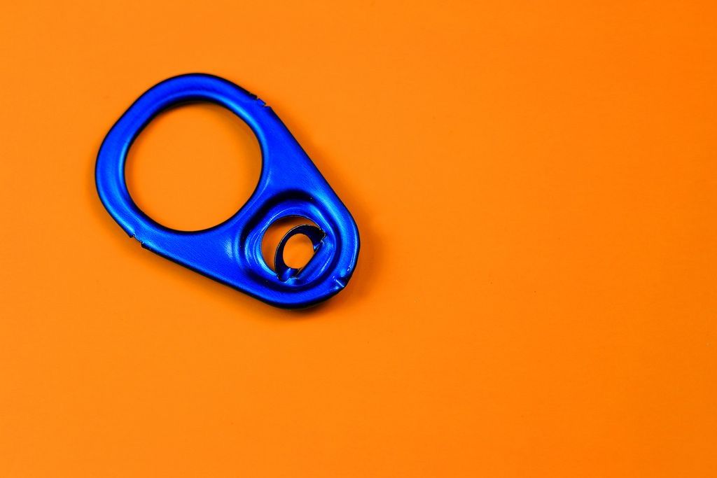 Blue Metal Ring on Orange Background