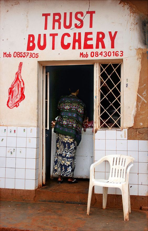 Woman Entering Butchery