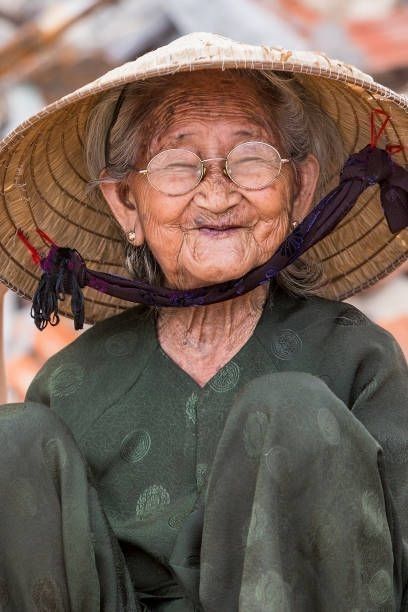 Elderly Woman Wearing Traditional Vietnamese Hat