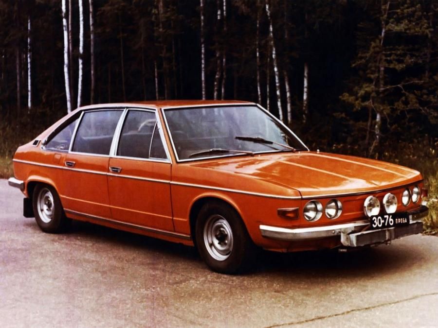 Vintage Orange Car in Forest