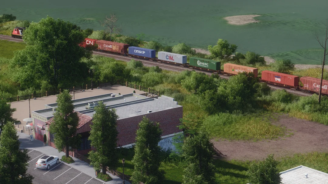 Freight Train Through Green Landscape