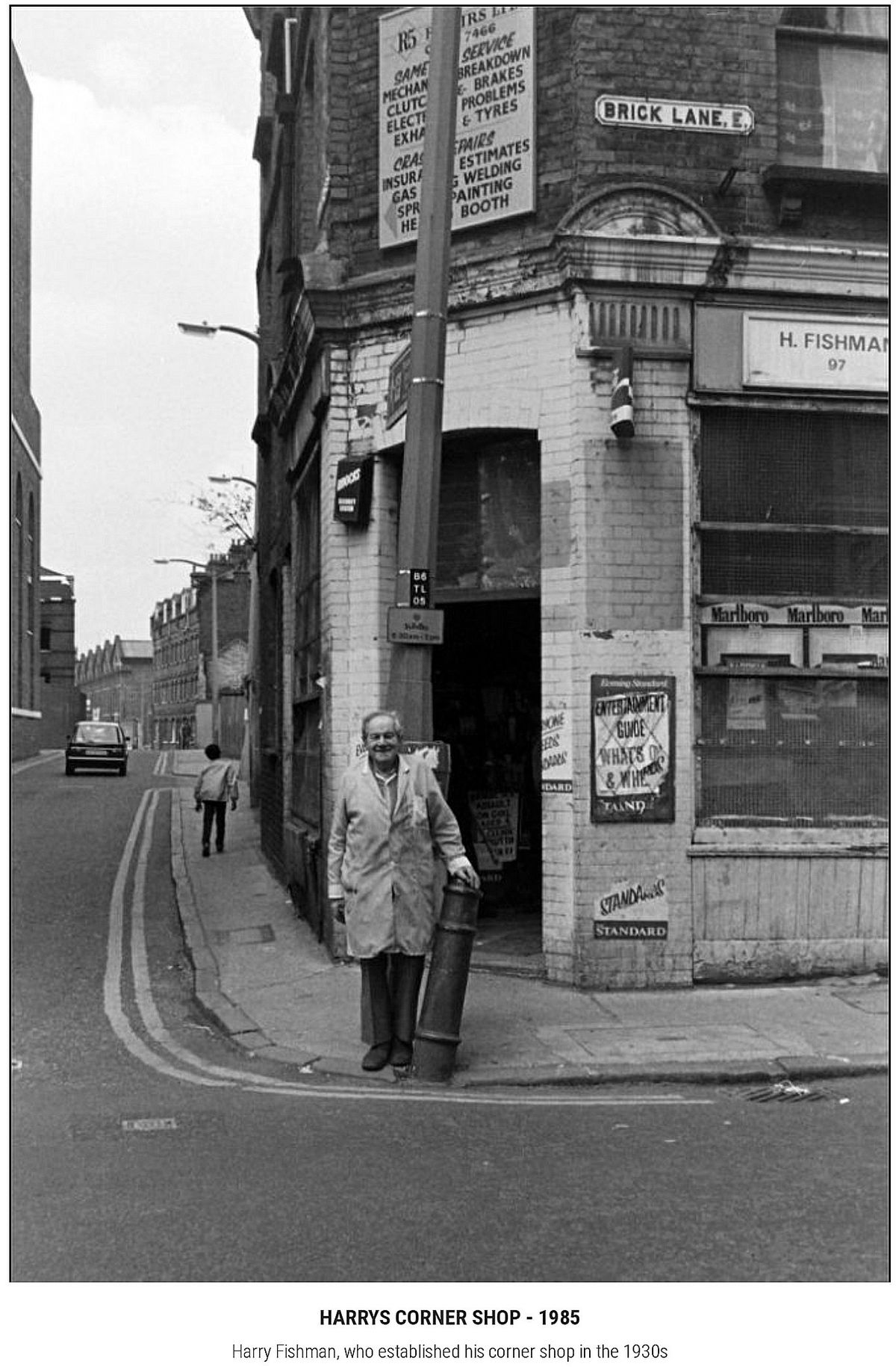 Man with Gas Cylinder Outside Shop