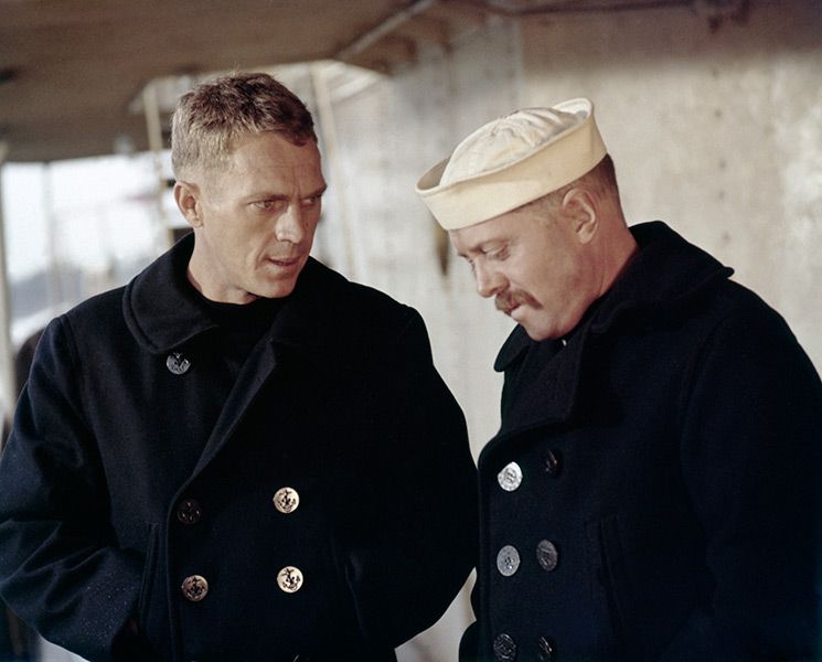 Two men in navy uniforms