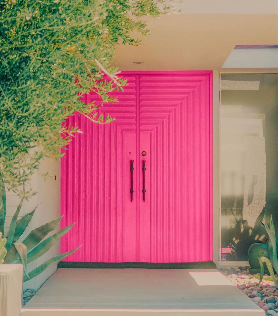 Bright Pink Doors Amid Greenery