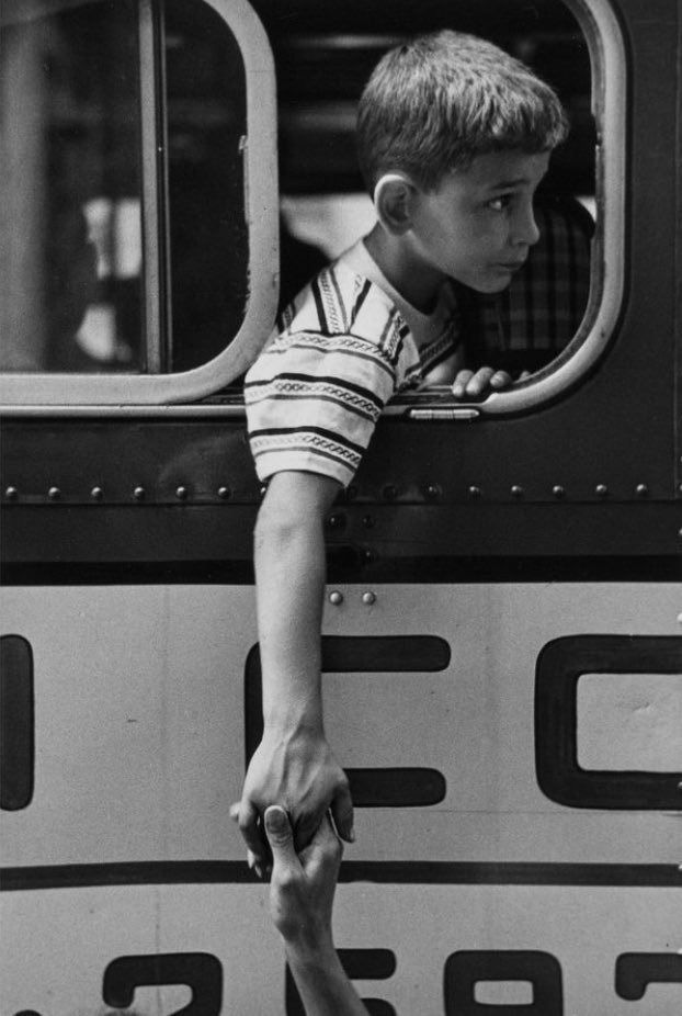 Boy Peering Out Train Window