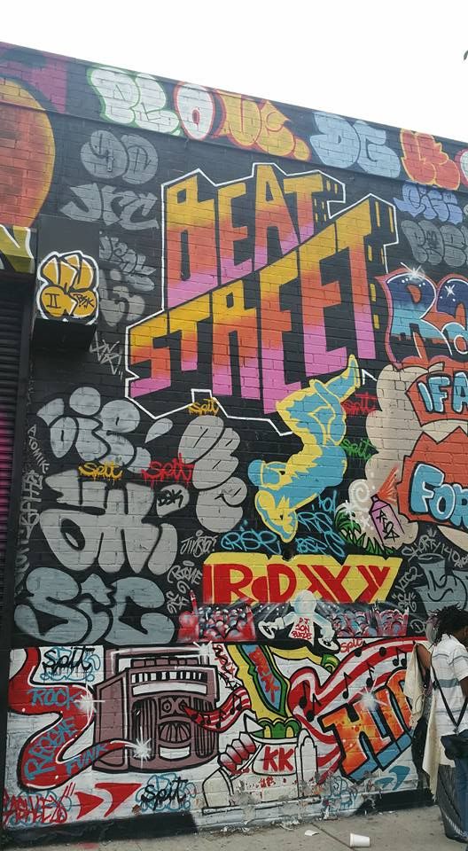 Graffiti-covered wall with bold 'HEART STREET' and 'ROXY'