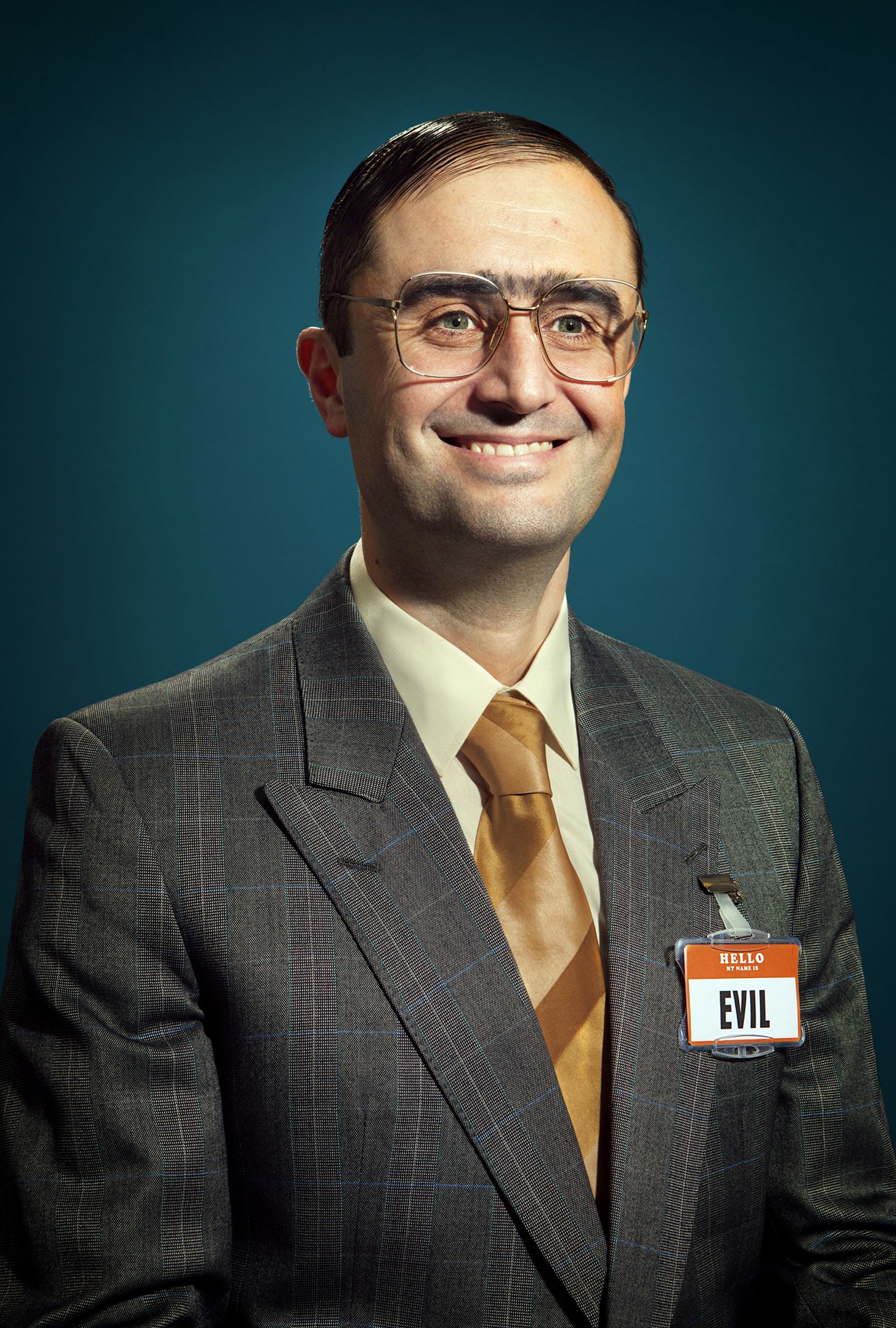 Man in Suit with Evil Name Tag